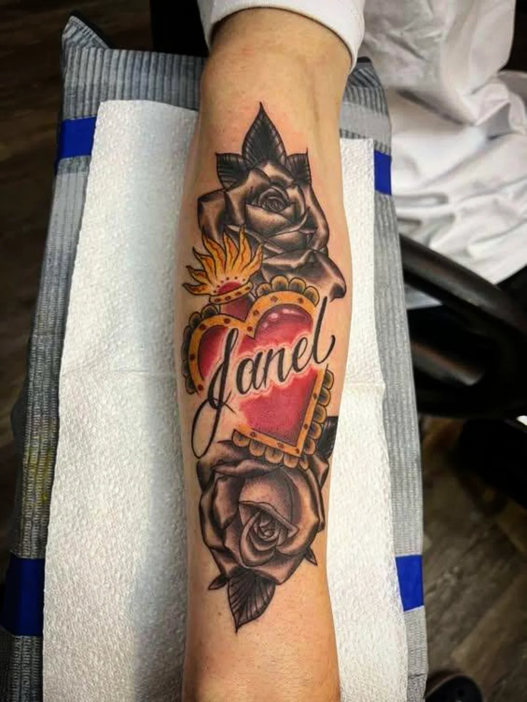 Heart with name American traditional tattoo on the forearm by Josh Sroga