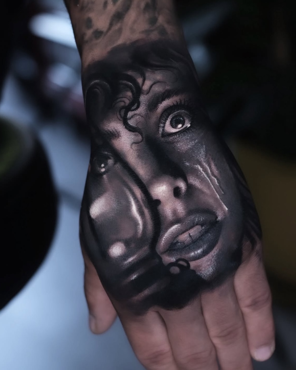 Portrait realism tattoo on the hand by Anton Martiushev