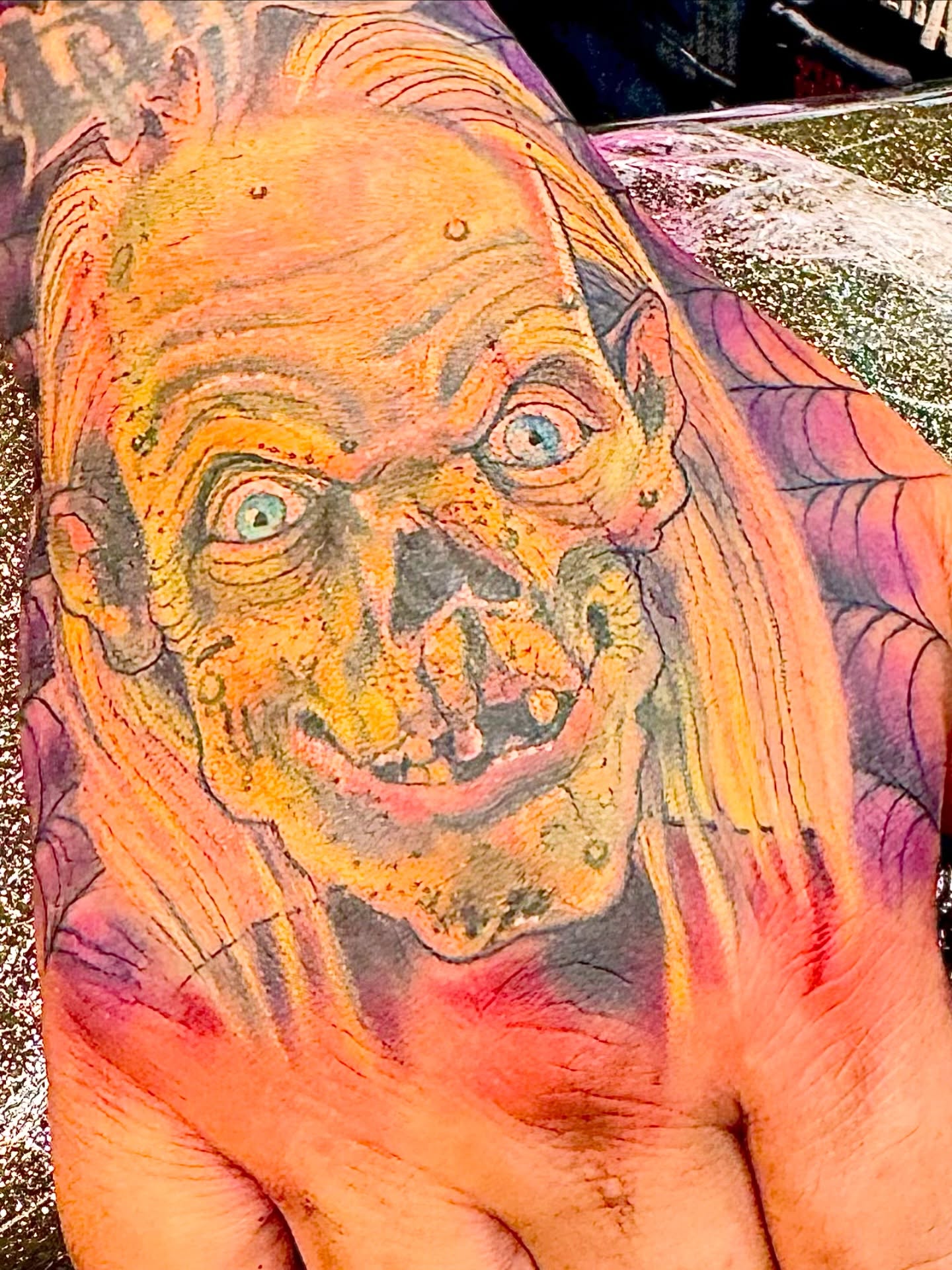 Zombie face realism tattoo on the hand by Dave Robinowitz