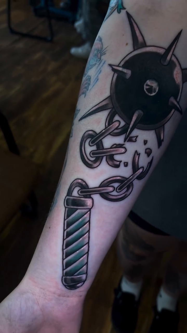 Flail and barber pole blackwork tattoo by Blake Alan Tattoos (TROUT)