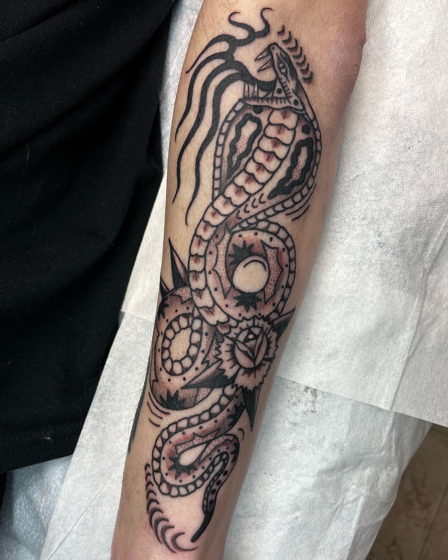 Snake dotwork tattoo on the forearm by Gerald Bellmore