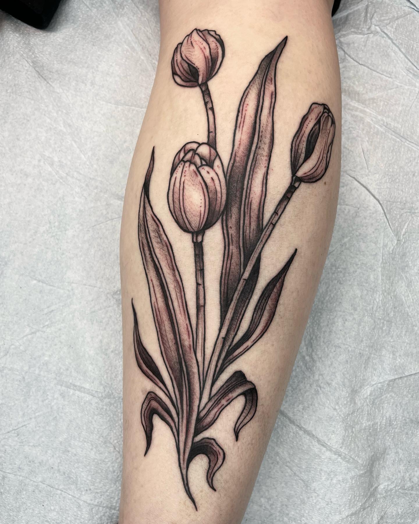 Tulips realism tattoo on the forearm by Gerald Bellmore