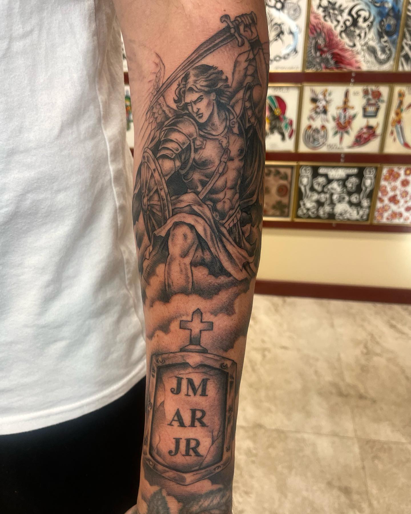 Angel with sword realism tattoo on the forearm by Gerald Bellmore