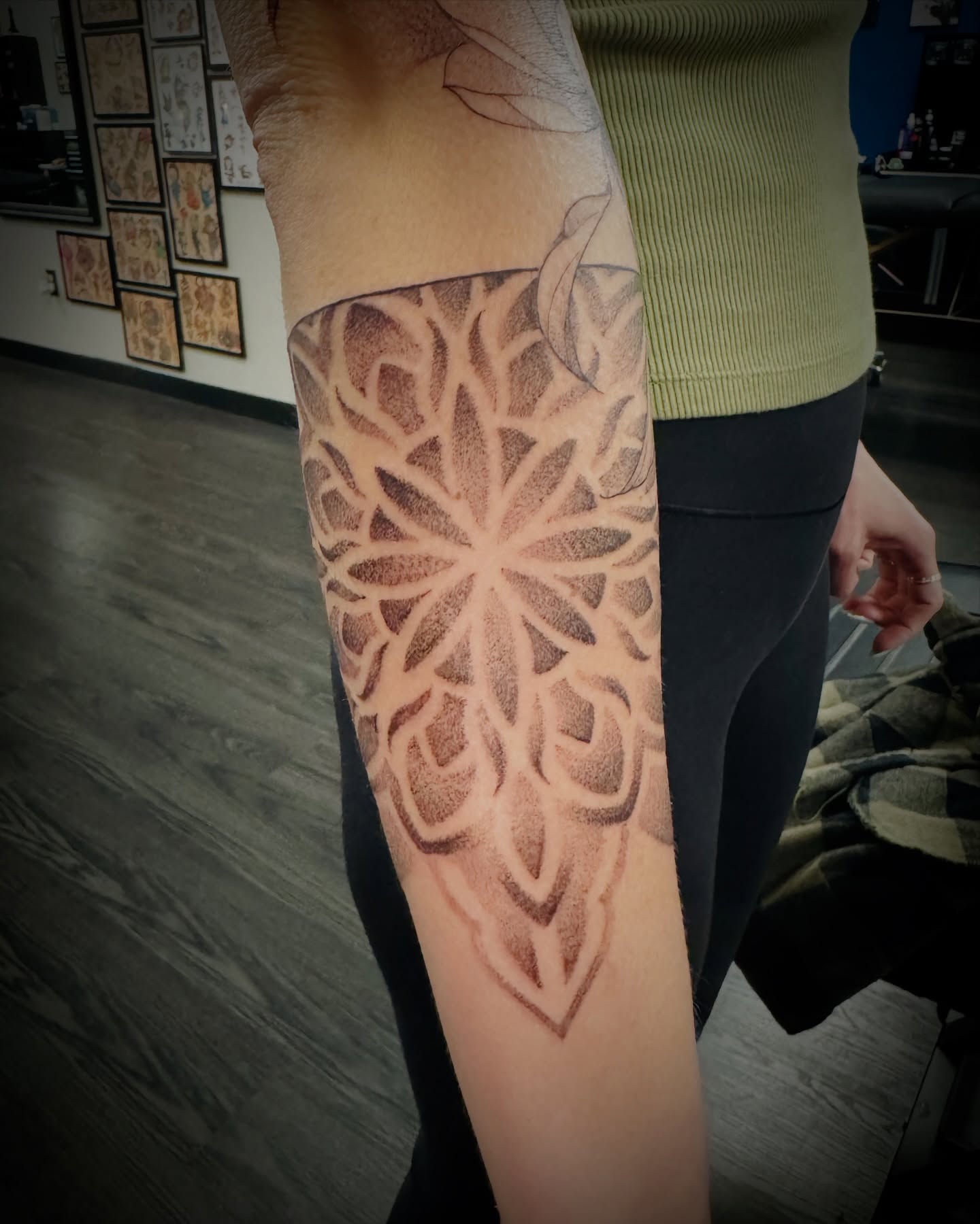 Geometric mandala dotwork tattoo on the forearm by IX