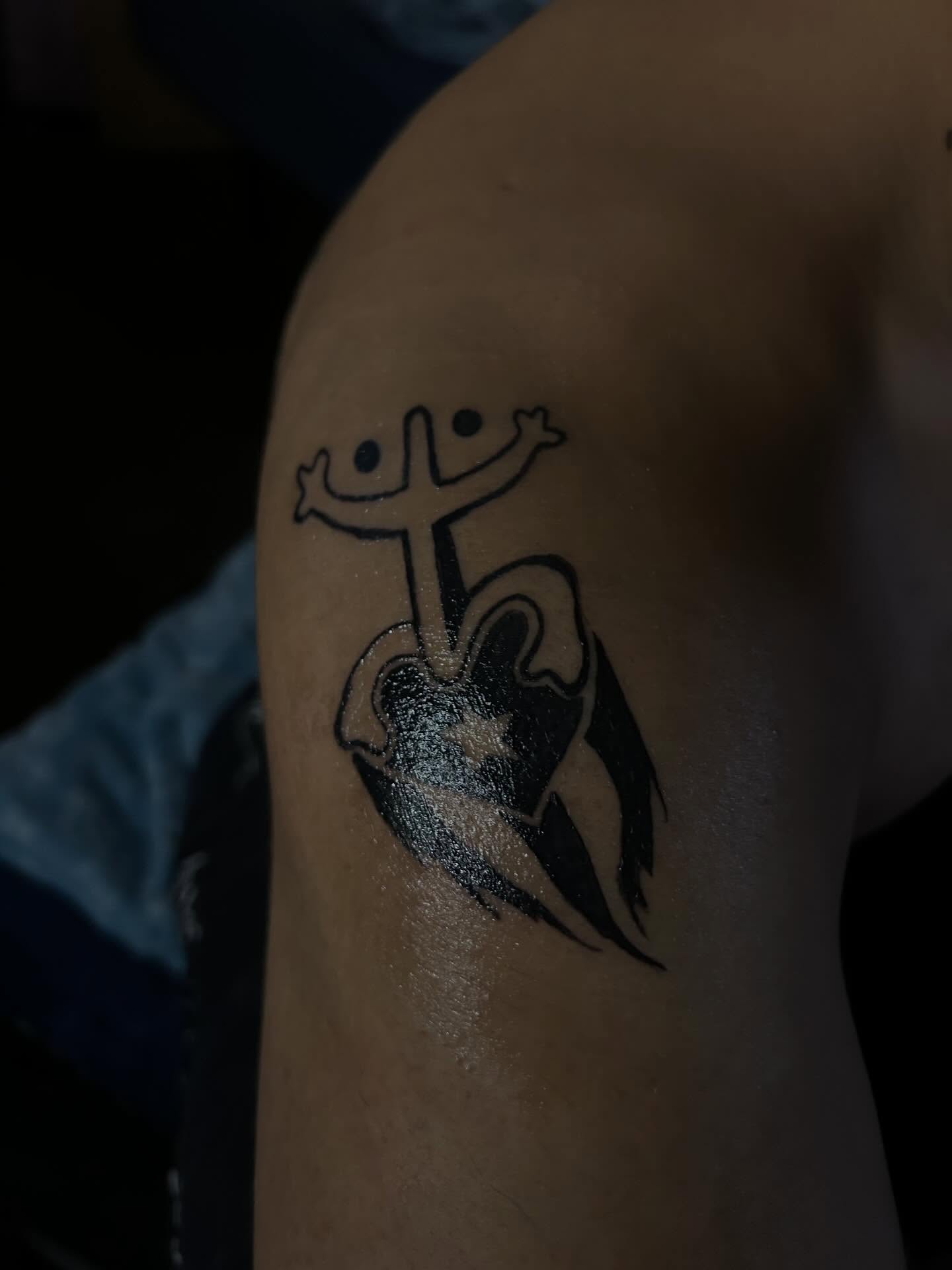 Cross with arms black and grey tattoo on the shoulder by @bloodline__legacy