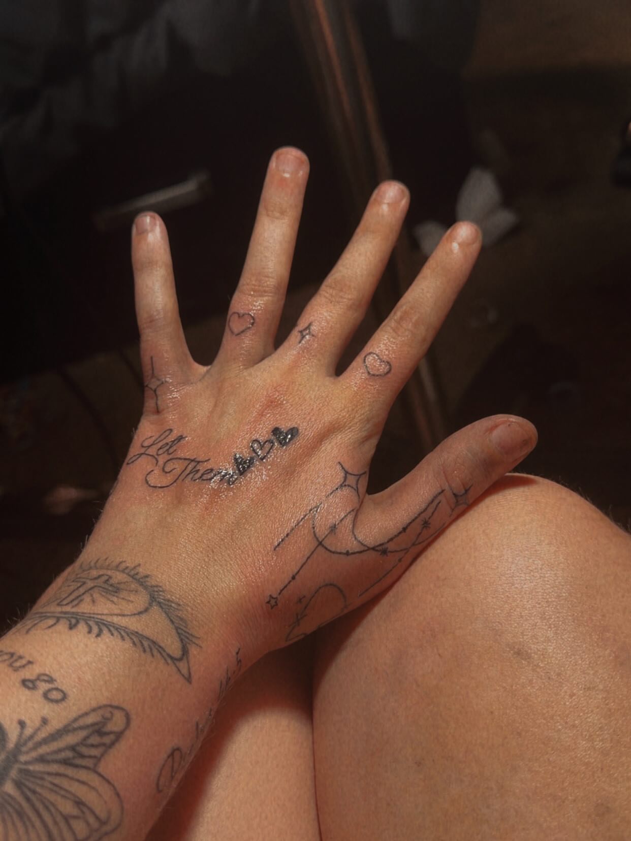 Hand with various tattoos black and grey tattoo on the hand by @bloodline__legacy