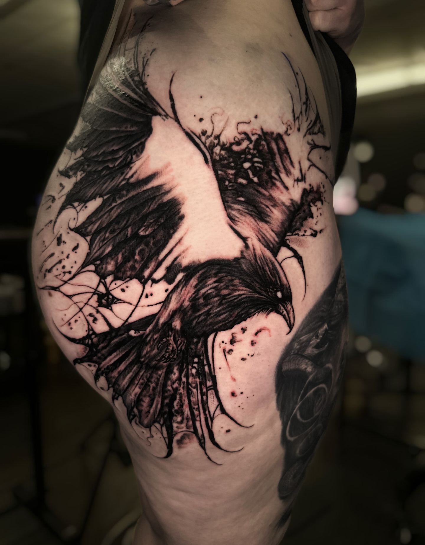 Woman with bird realism tattoo on the thigh by Jesse White, Mentor, Ohio