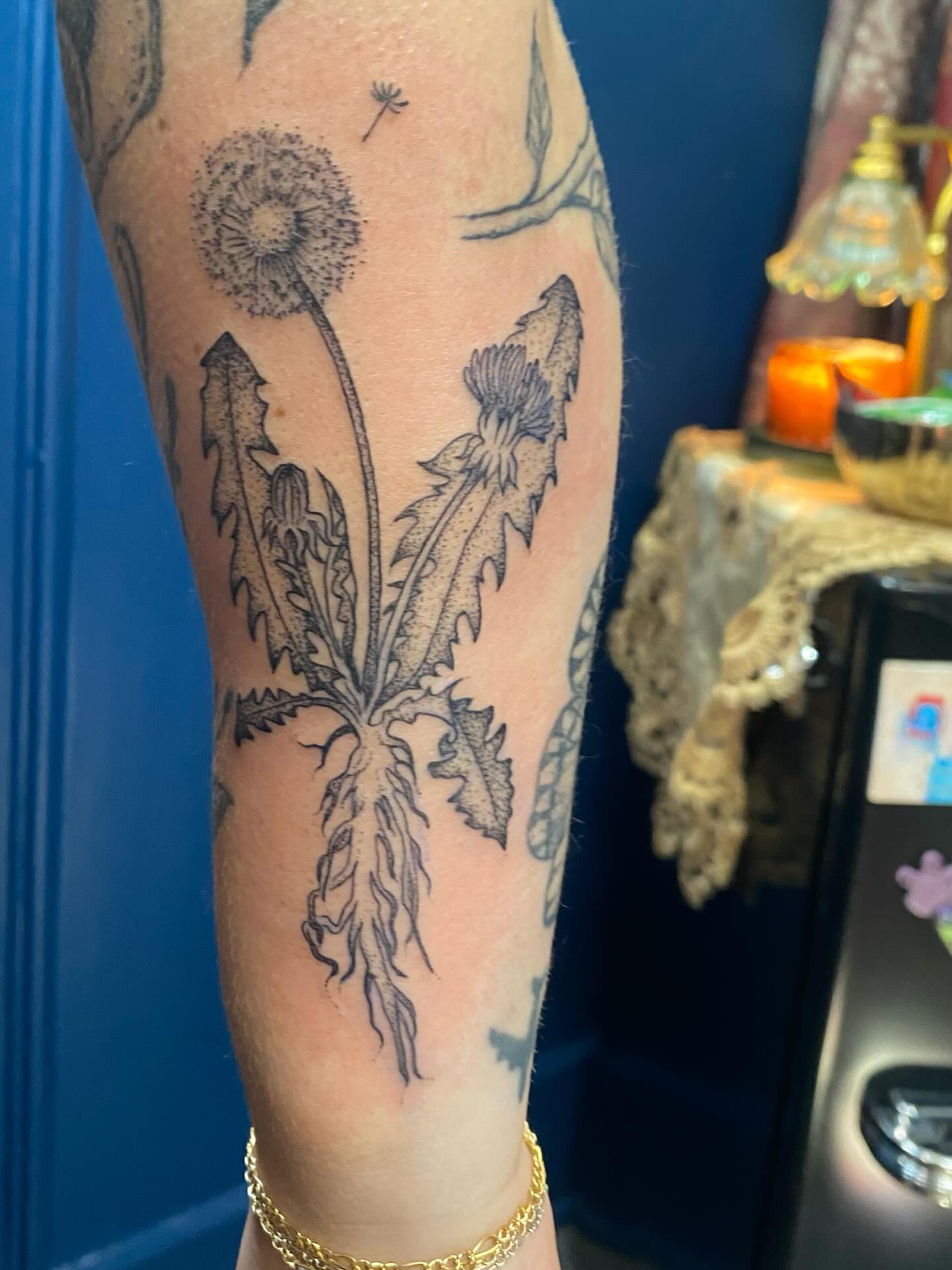 Dandelion dotwork tattoo on the forearm by Jesikah Rapp