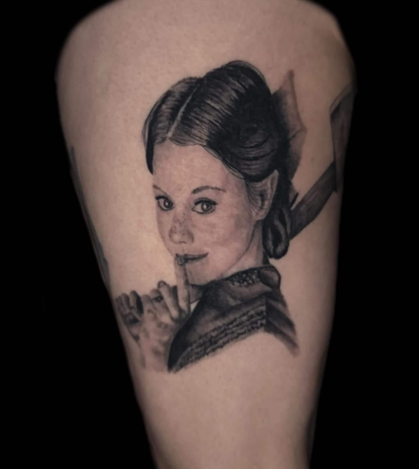 Woman with bow realism tattoo on the forearm by Jacob Bettker, Centerville, Ohio