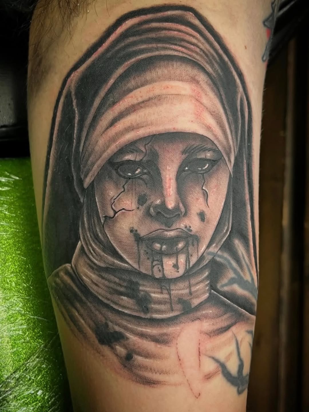 Cracked nun portrait realism tattoo on the forearm by Joseph Kuma Warren, Memphis, Tennessee