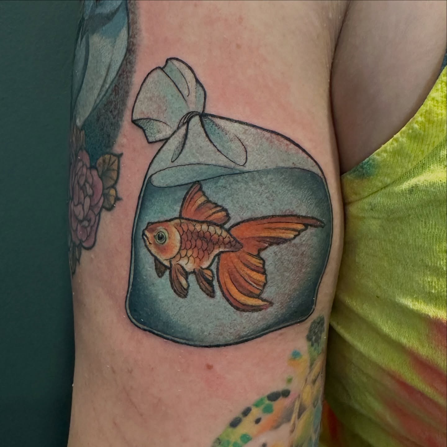 Goldfish in bag realism tattoo on the forearm by Katie Hutchins, Dayton, Ohio