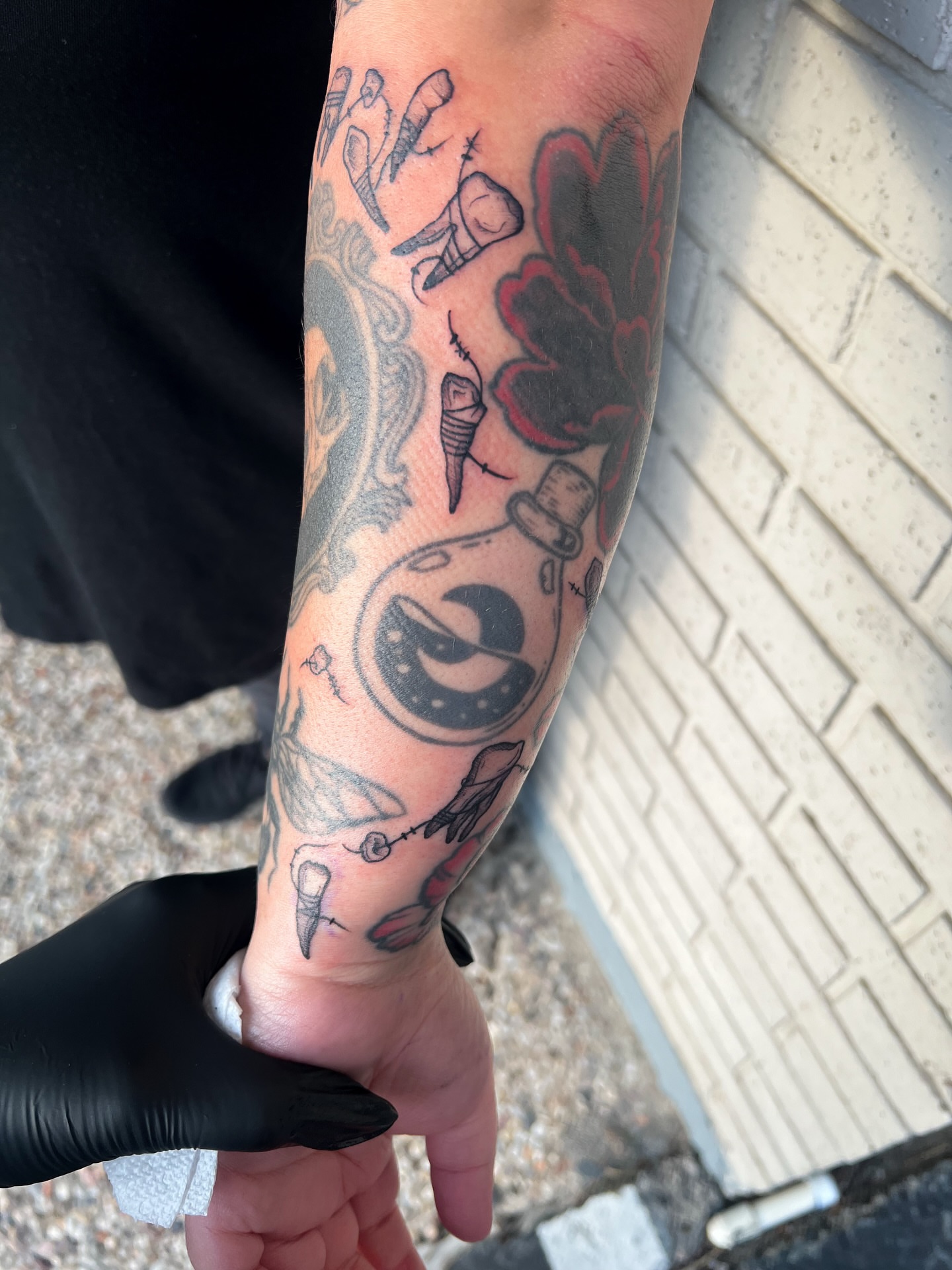 Bottle with cork American traditional tattoo on the forearm by Houston Tattoo Artist