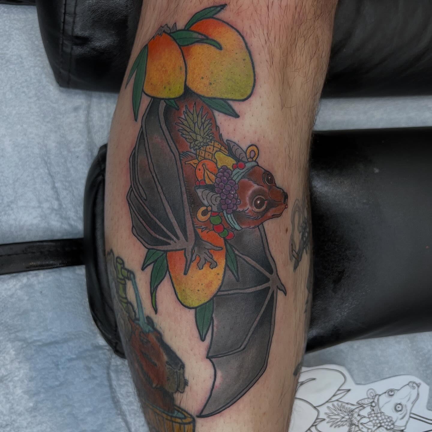 Bat with fruit American traditional tattoo on the forearm by Troy David Souders