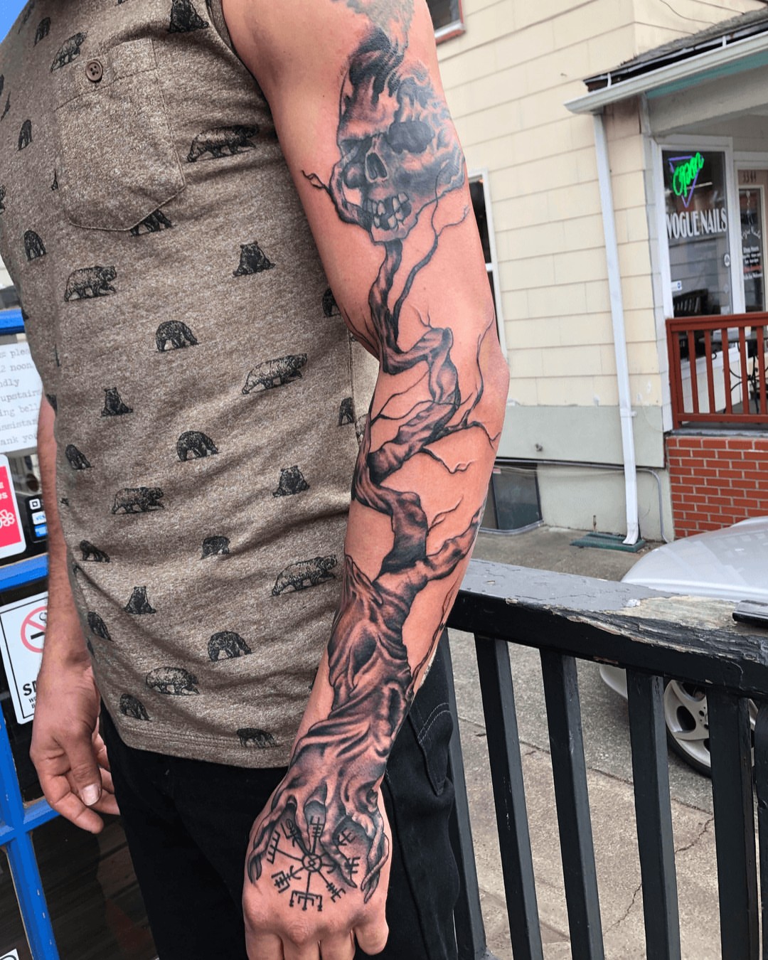 Skull and tree realism tattoo on the upper arm by Gabriel Torres