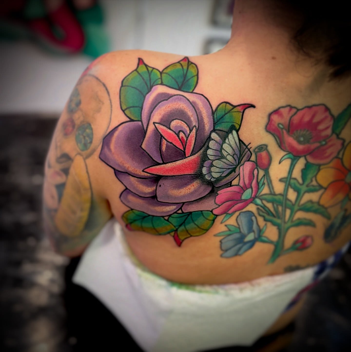 Floral bouquet American traditional tattoo on the back by Ogden Tattoo Parlor