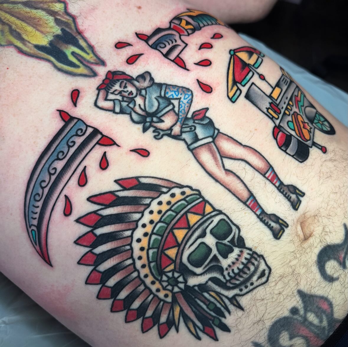 Indian headdress and skull American traditional tattoo on the thigh by Larry Love