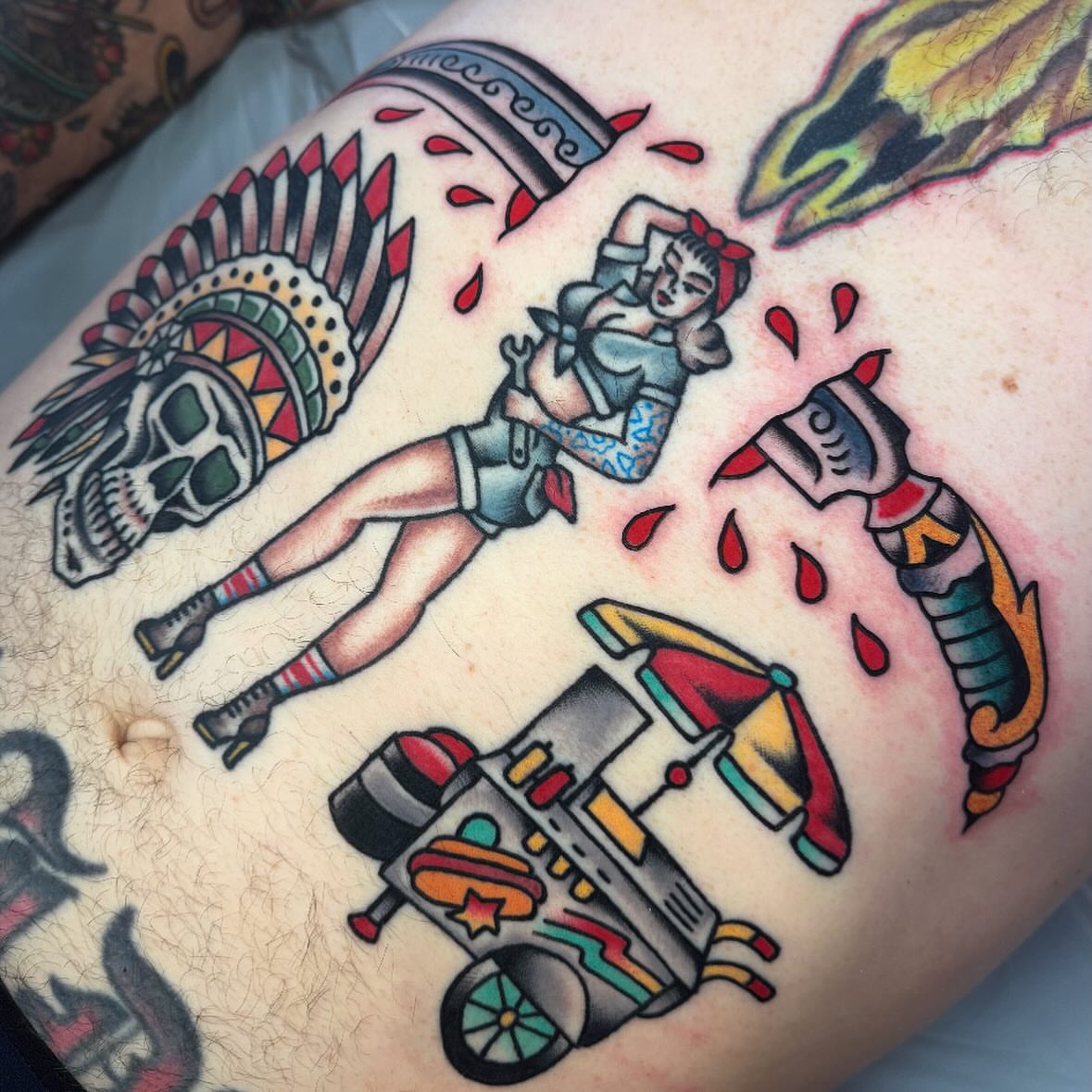 Indian headdress and pin-up girl American traditional tattoo on the thigh by Larry Love