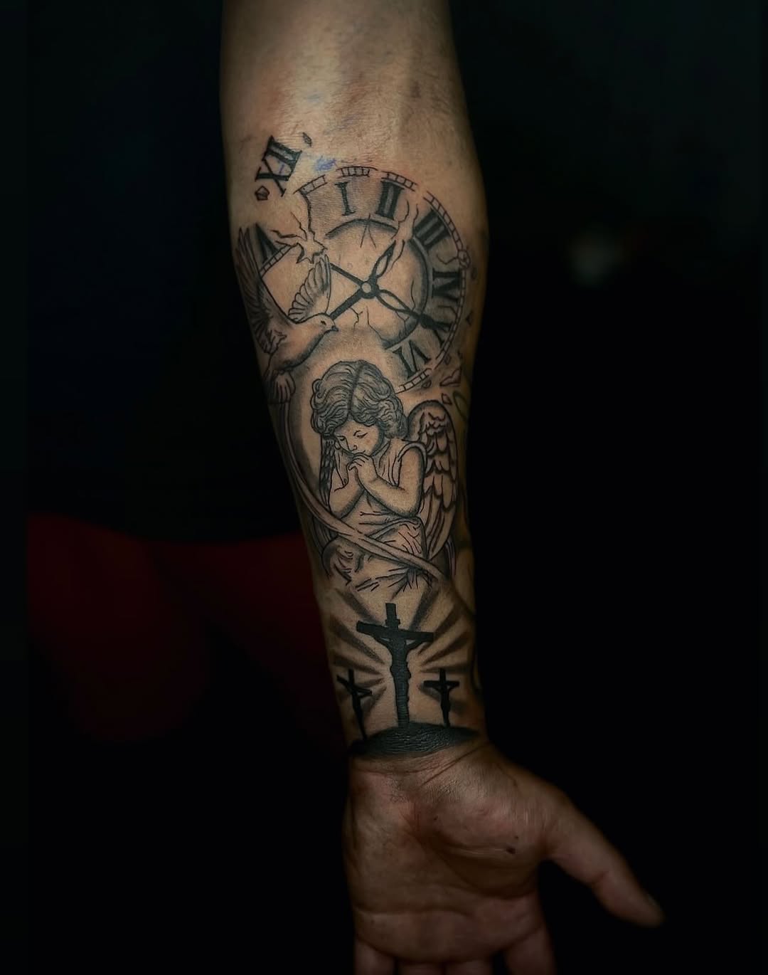 Angel, clock, dove, and crosses realism tattoo on the forearm by @tattsbyleek