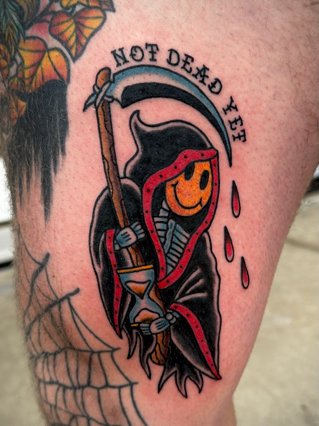 Grim reaper American traditional tattoo on the thigh by Zach Eden