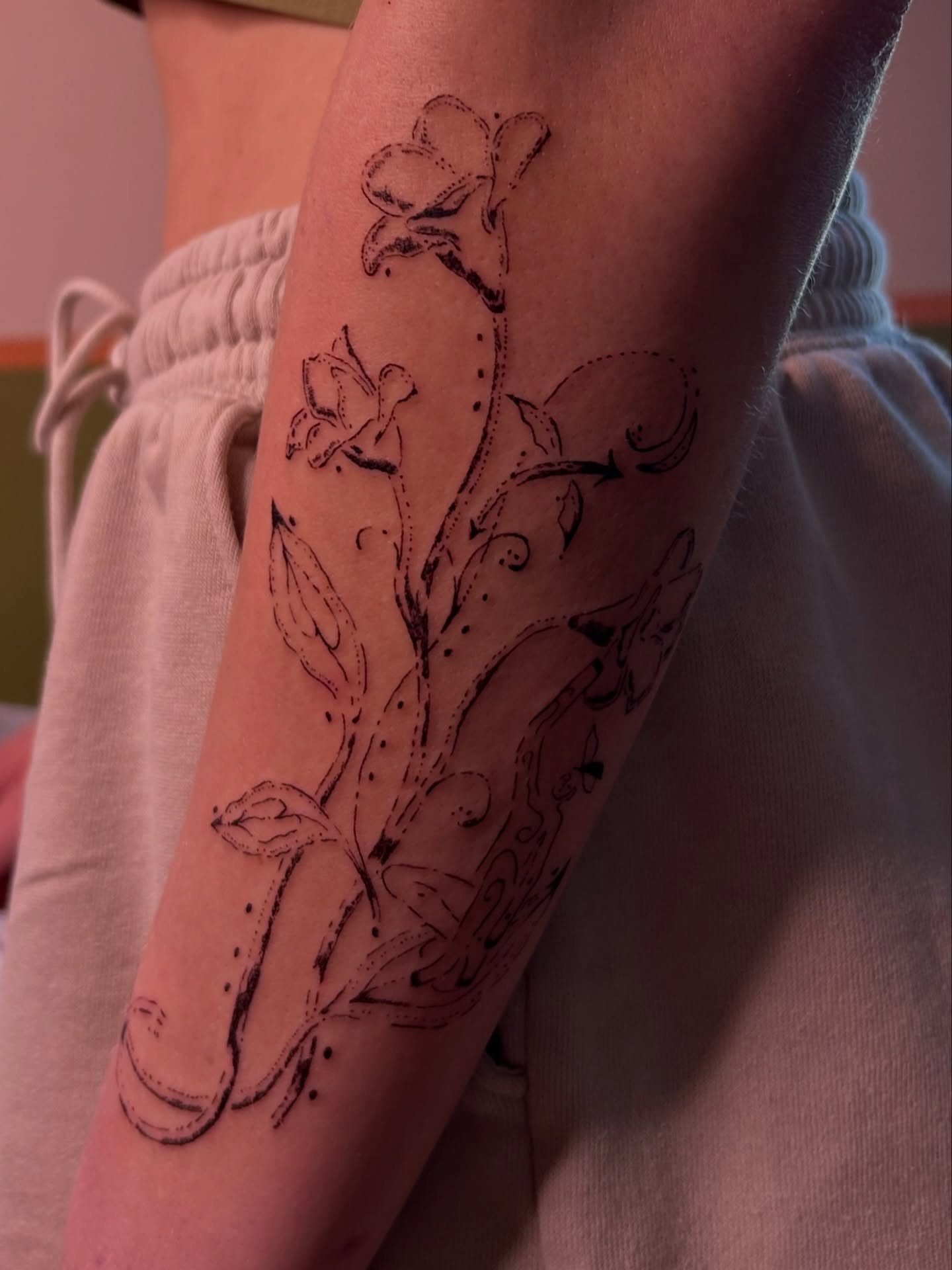 Floral vine dotwork tattoo on the forearm by wanderfernfairy
