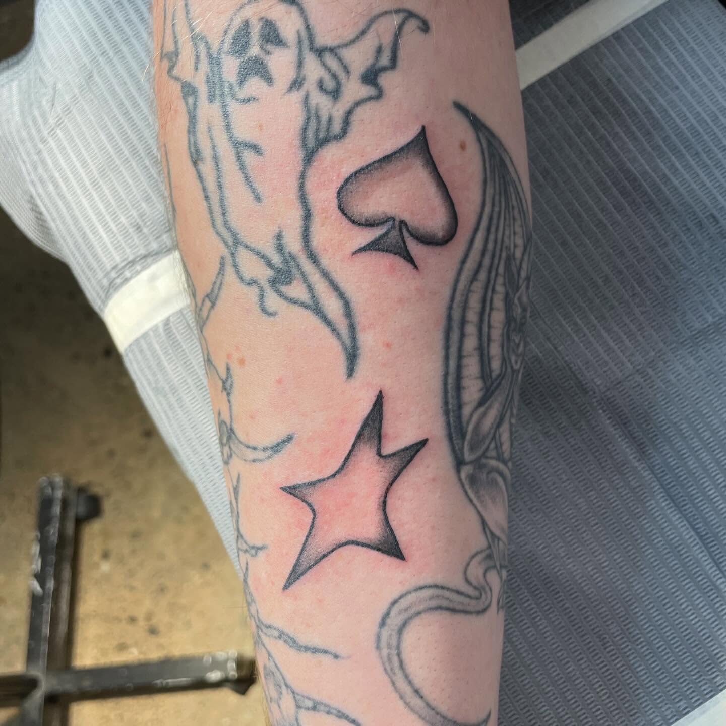 Spade and star black and grey tattoo on the forearm by ★ eliza rodriguez🇲🇽 ★