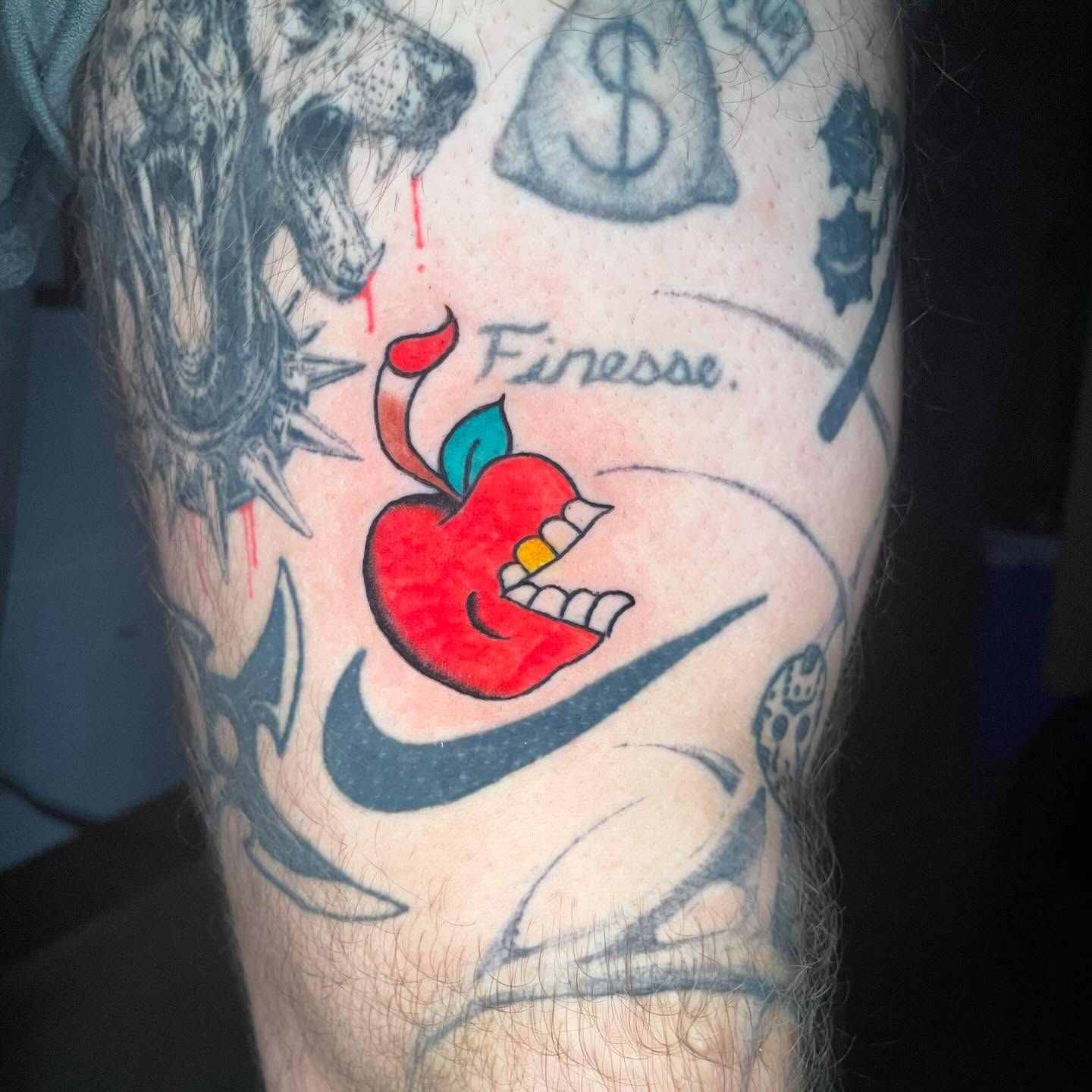 Apple with teeth new school tattoo on the forearm by ★ eliza rodriguez🇲🇽 ★