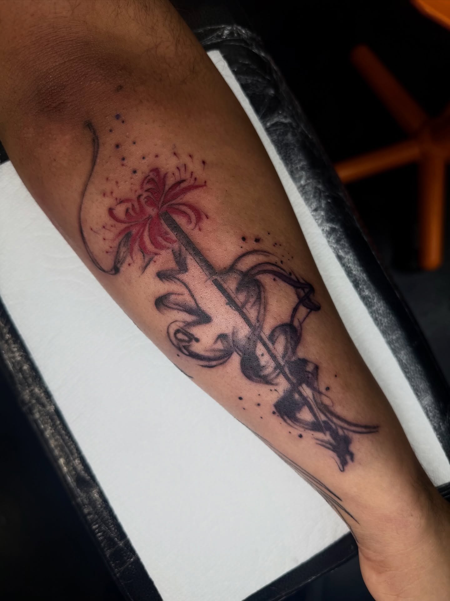 Flower and abstract design dotwork tattoo on the forearm by Bryan Nguyen