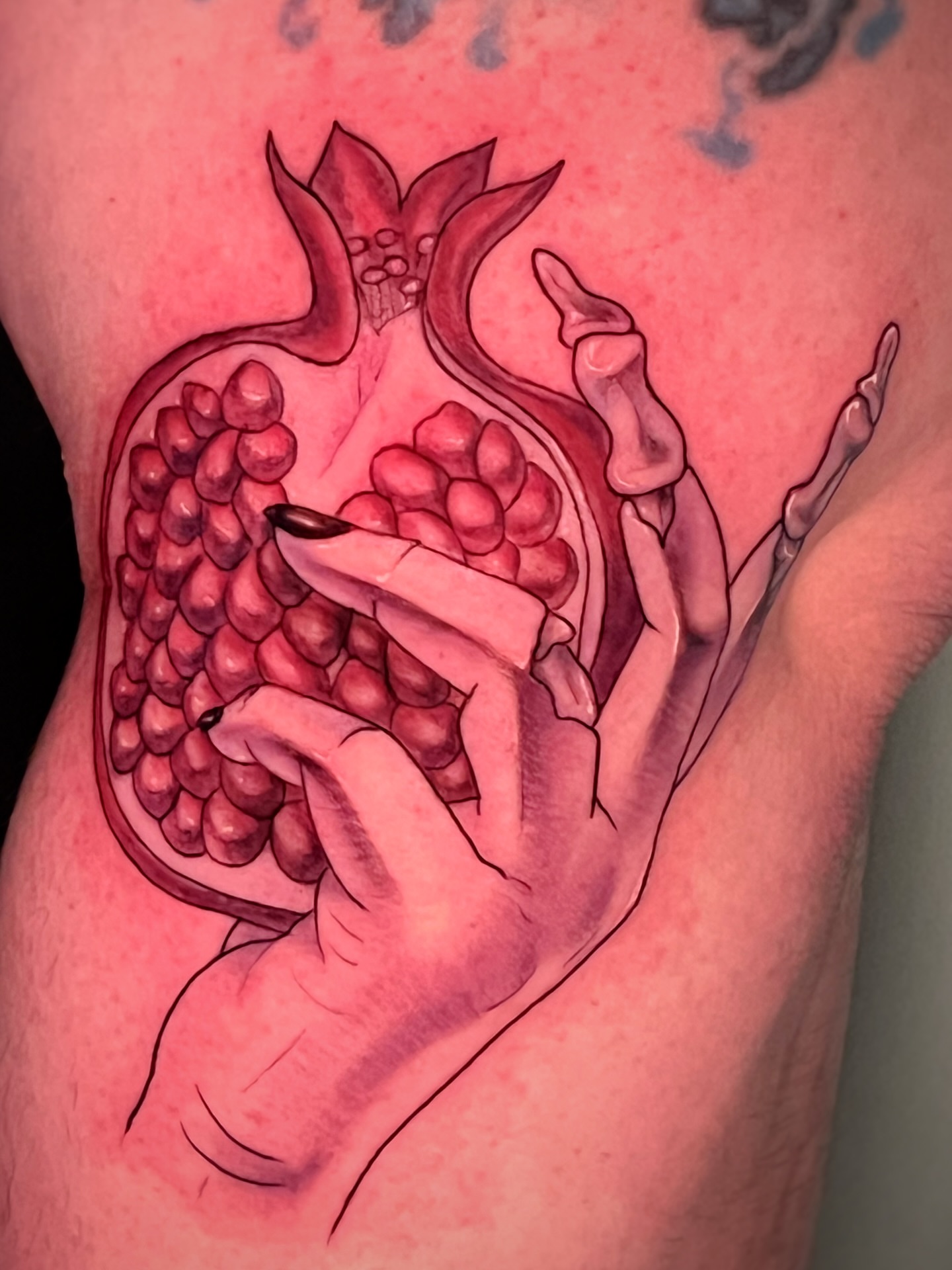Pomegranate realism tattoo on the thigh by Michelle Pomerantz 🌼 Portland Tattoo Artist