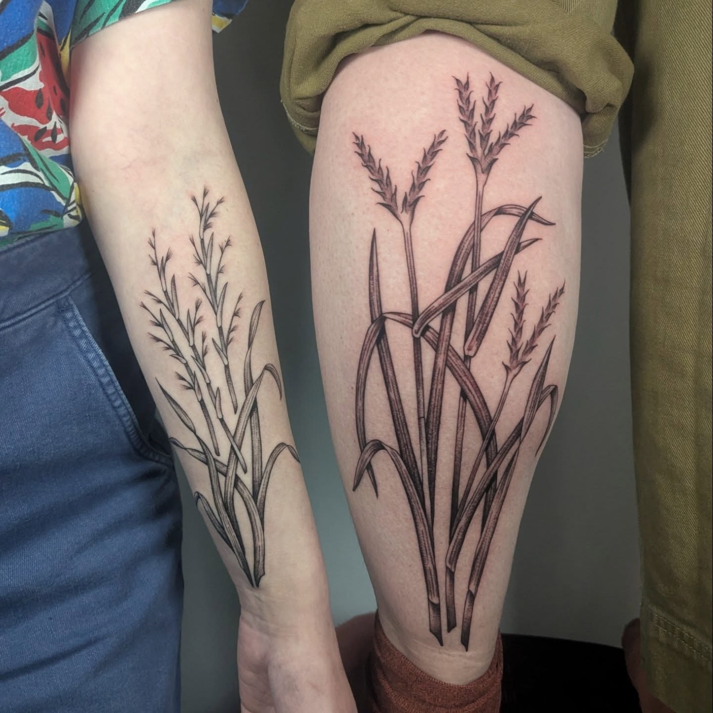 Grass black and grey tattoo on the thigh by Courtney Yaddof