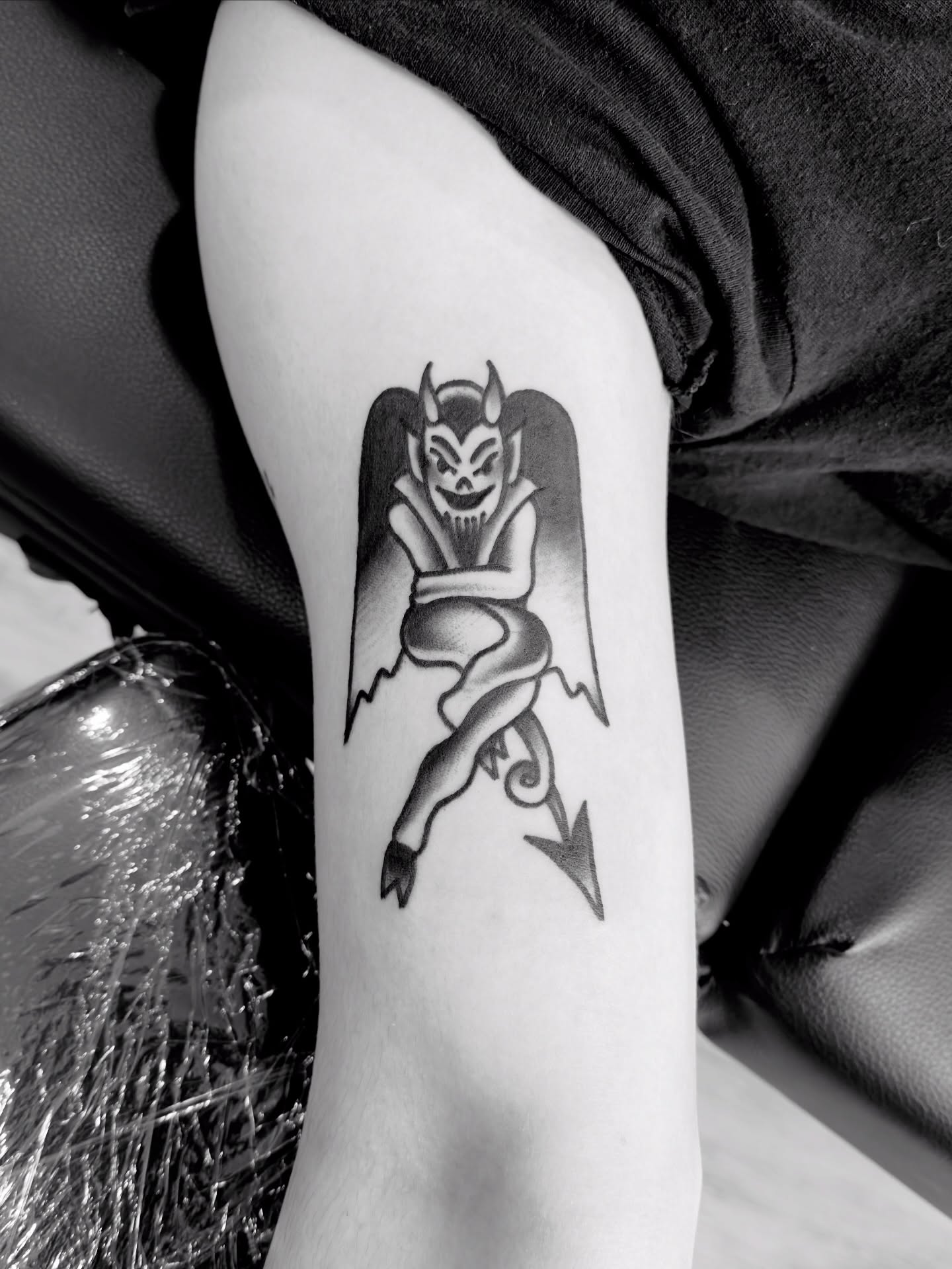 Demon black and grey tattoo on the thigh by Jimmy Kelley