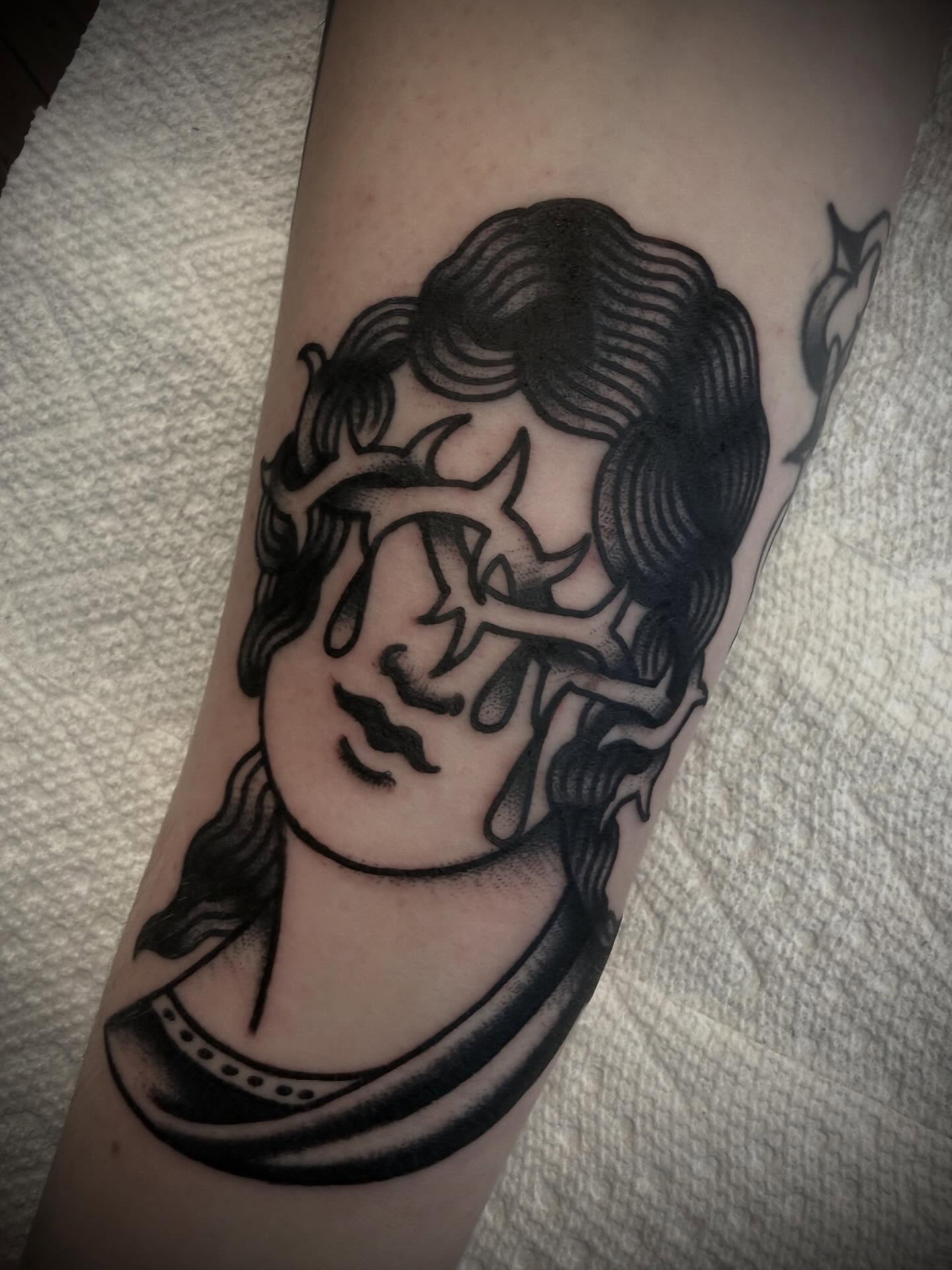 Woman's head black and grey tattoo on the forearm by Andrew Slater