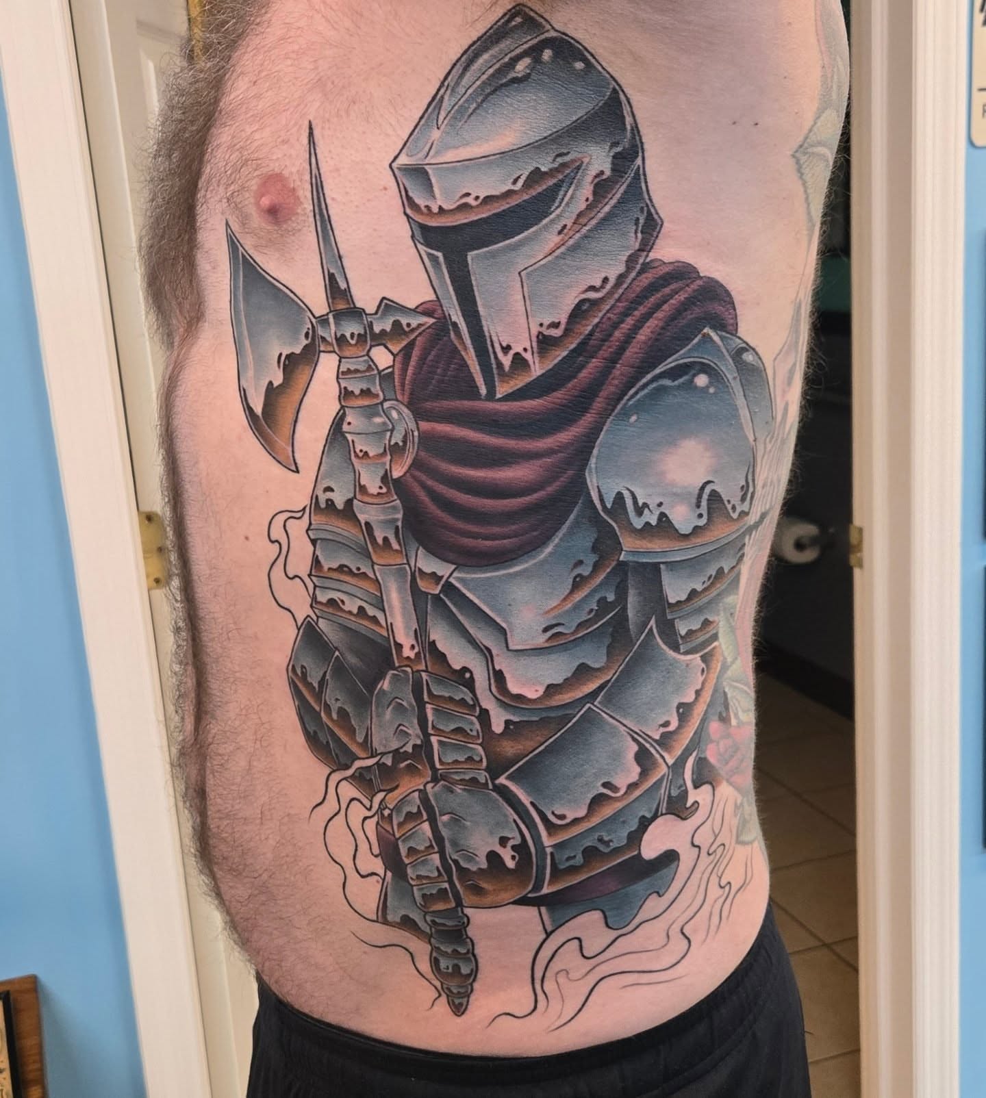 Knight realism tattoo on the torso by Jeff Stager