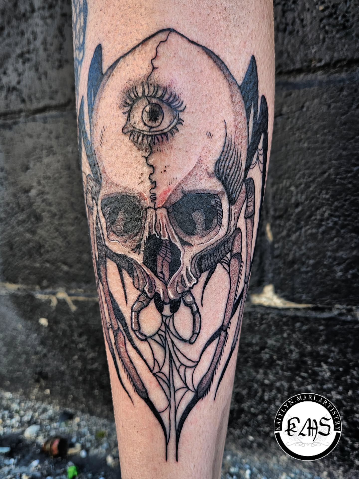 Skull with eye realism tattoo on the forearm by Kaitlyn Marianna Skewes 🌙 Illustrative