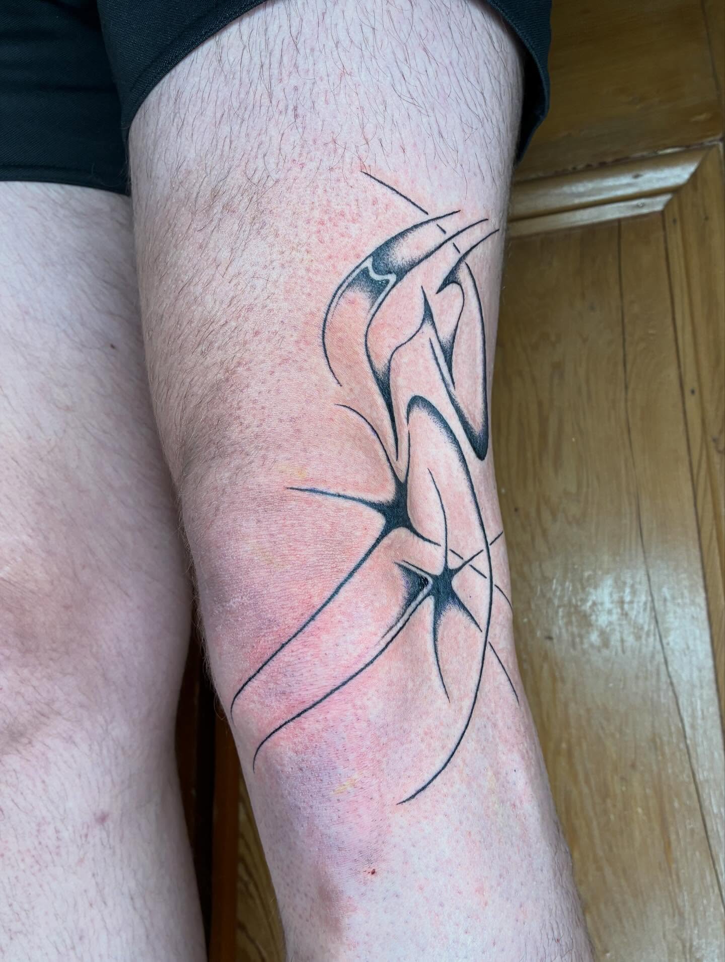 Abstract design geometric tattoo on the calf by Steven Sessler, San Francisco, California