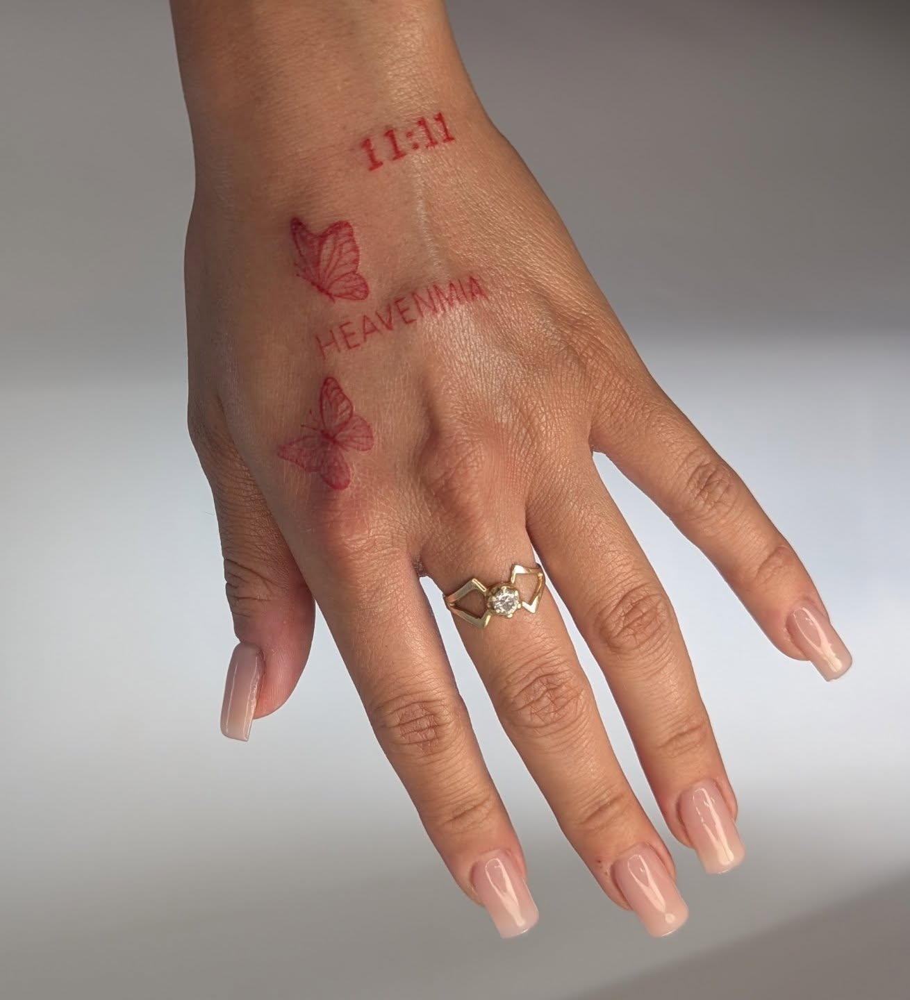 Butterfly geometric tattoo on the hand by Nenookaasi Martin