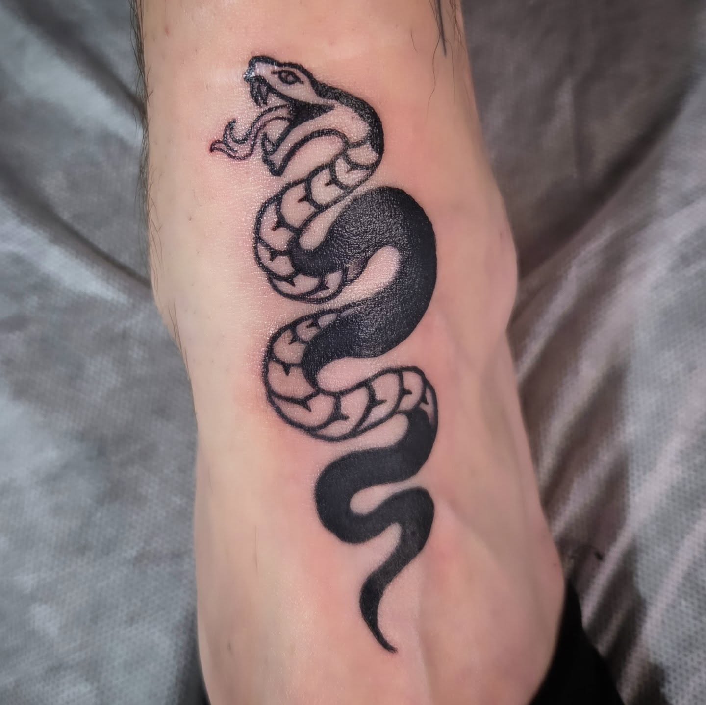 Snake black and grey tattoo on the forearm by Jam ⚡️🐉🖤
