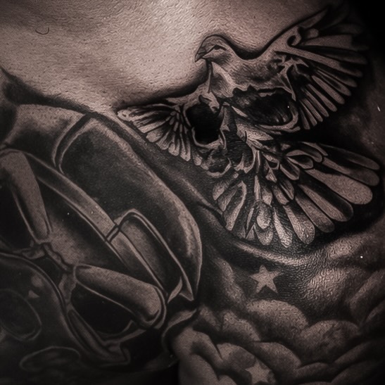 Skull with dove realism tattoo on the chest by Shane Boss, Toronto, Ontario