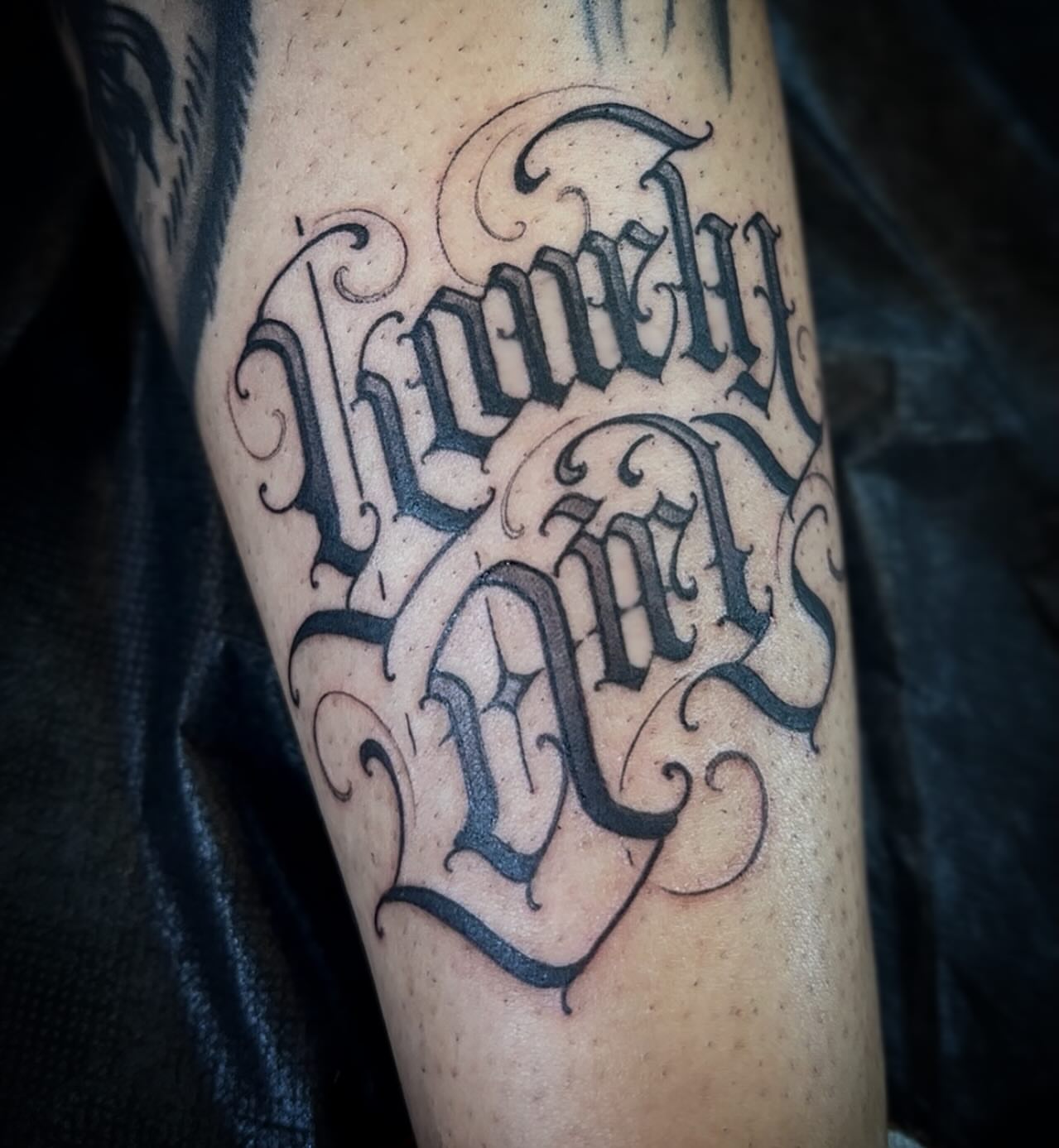 Script lettering lettering script tattoo on the forearm by Tattoos By Deft