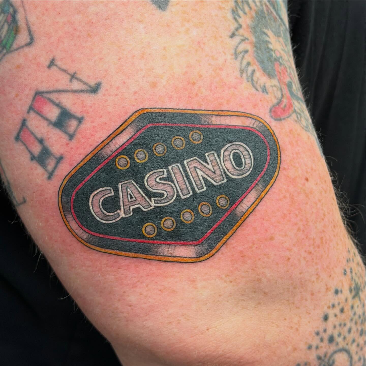 Casino sign dotwork tattoo on the forearm by Olivia Norbert