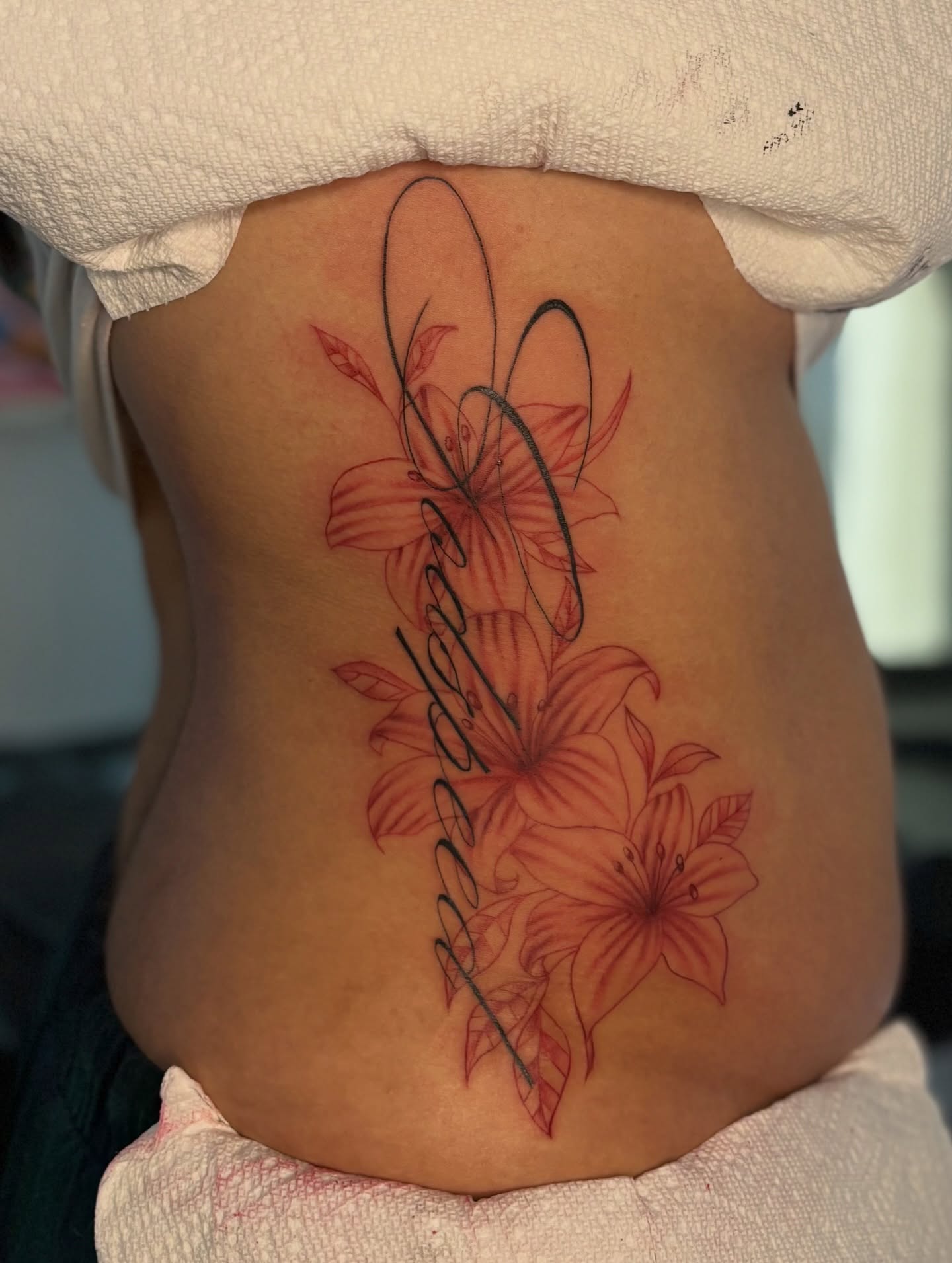 Lilies new school tattoo on the torso by the ink witch ๐ฎ๐ค๐