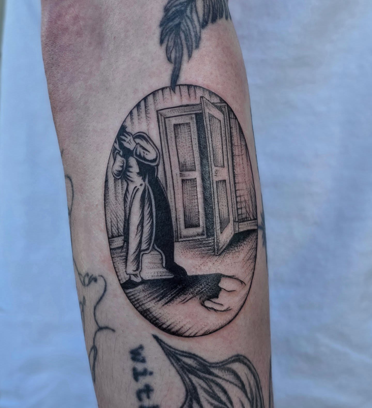 Door and figure dotwork tattoo on the forearm by Sierra (cc) Klein