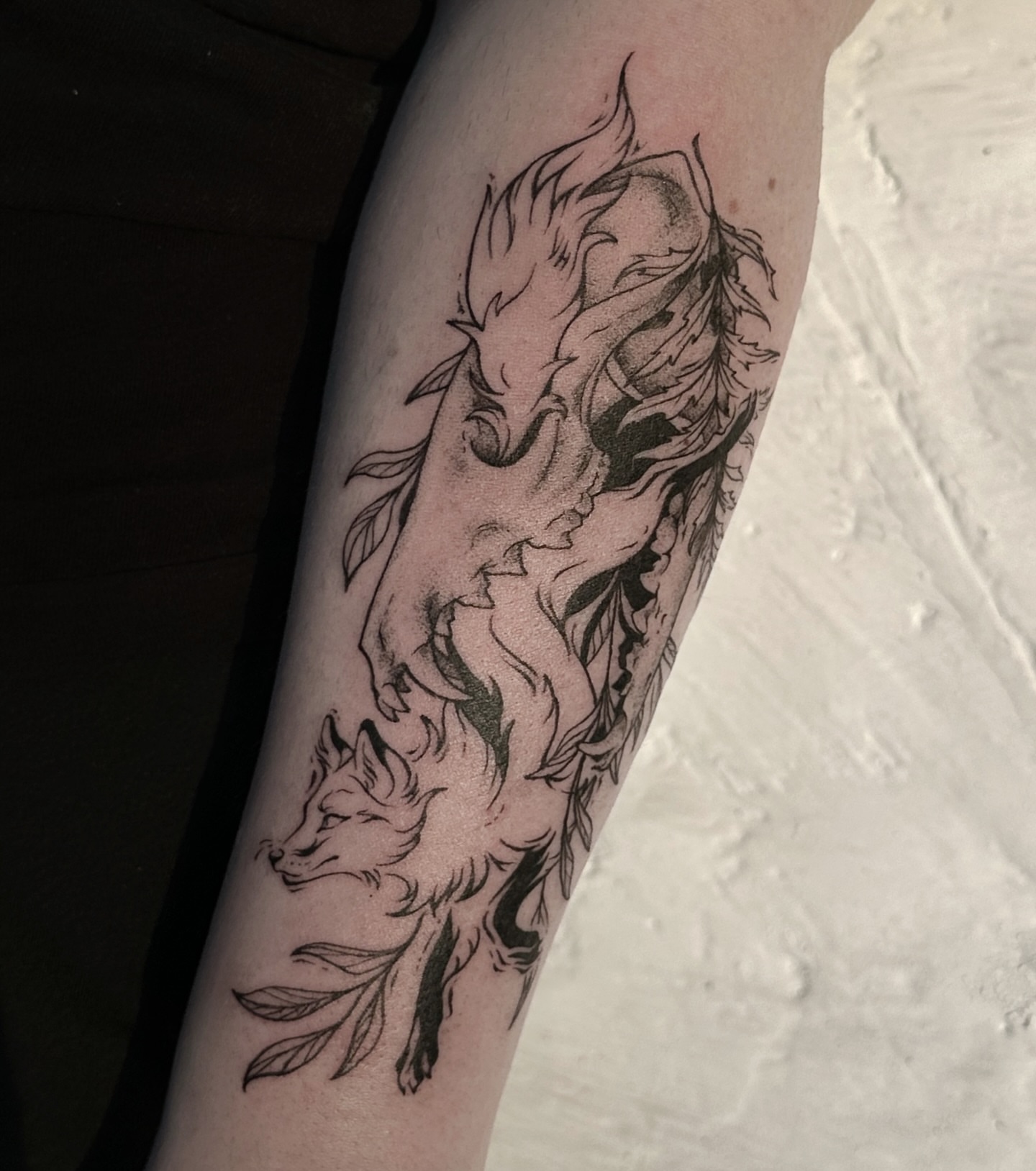 Foxes black and grey tattoo on the forearm by Micky, Austin, Texas