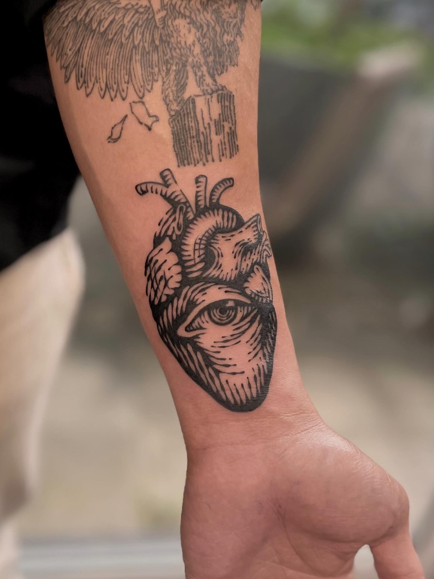 Anatomical heart with eye realism tattoo on the forearm by Wonny
