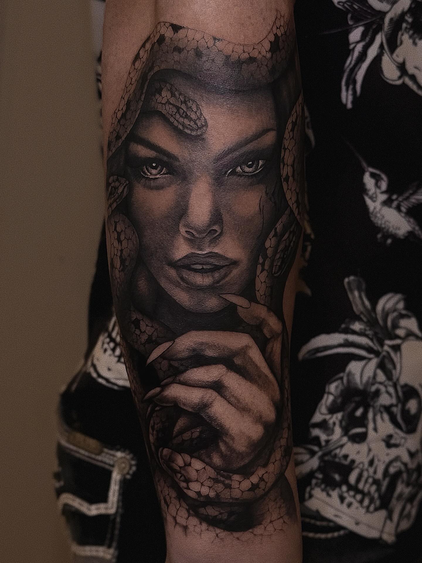 Woman with snakes realism tattoo on the forearm by Lissy Red