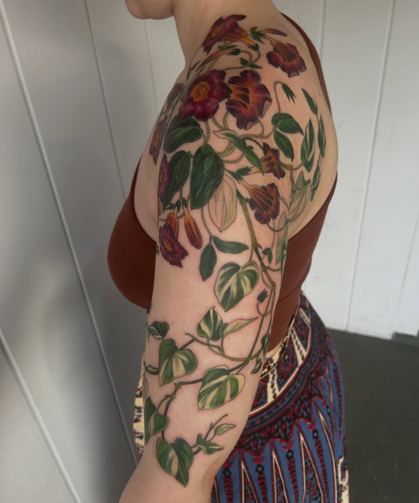 Morning glory vines realism tattoo on the upper arm by Anna Sylvan Tattoos