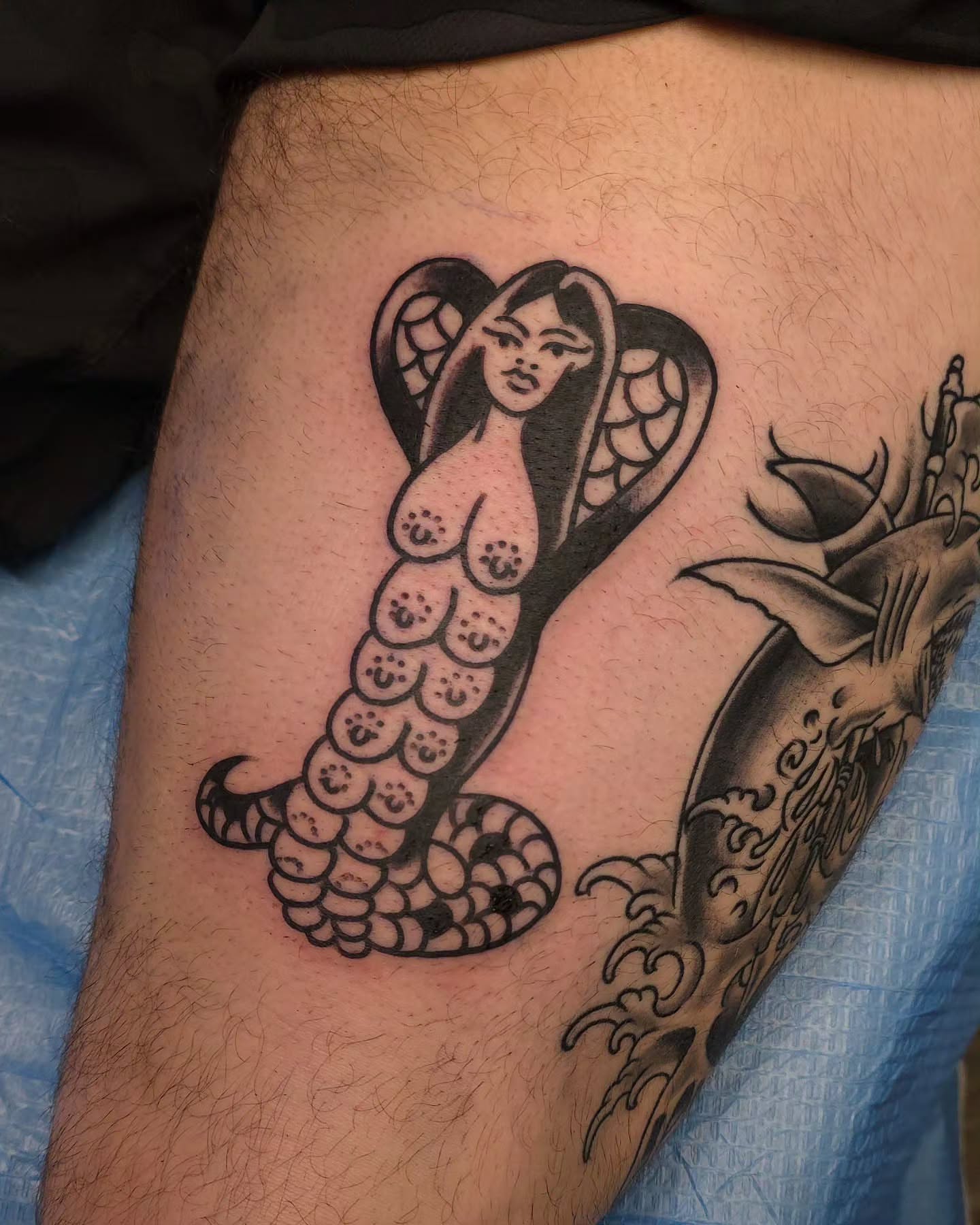 Woman with snake black and grey tattoo on the thigh by J. Kirsch New Jersey Tattoo Artist