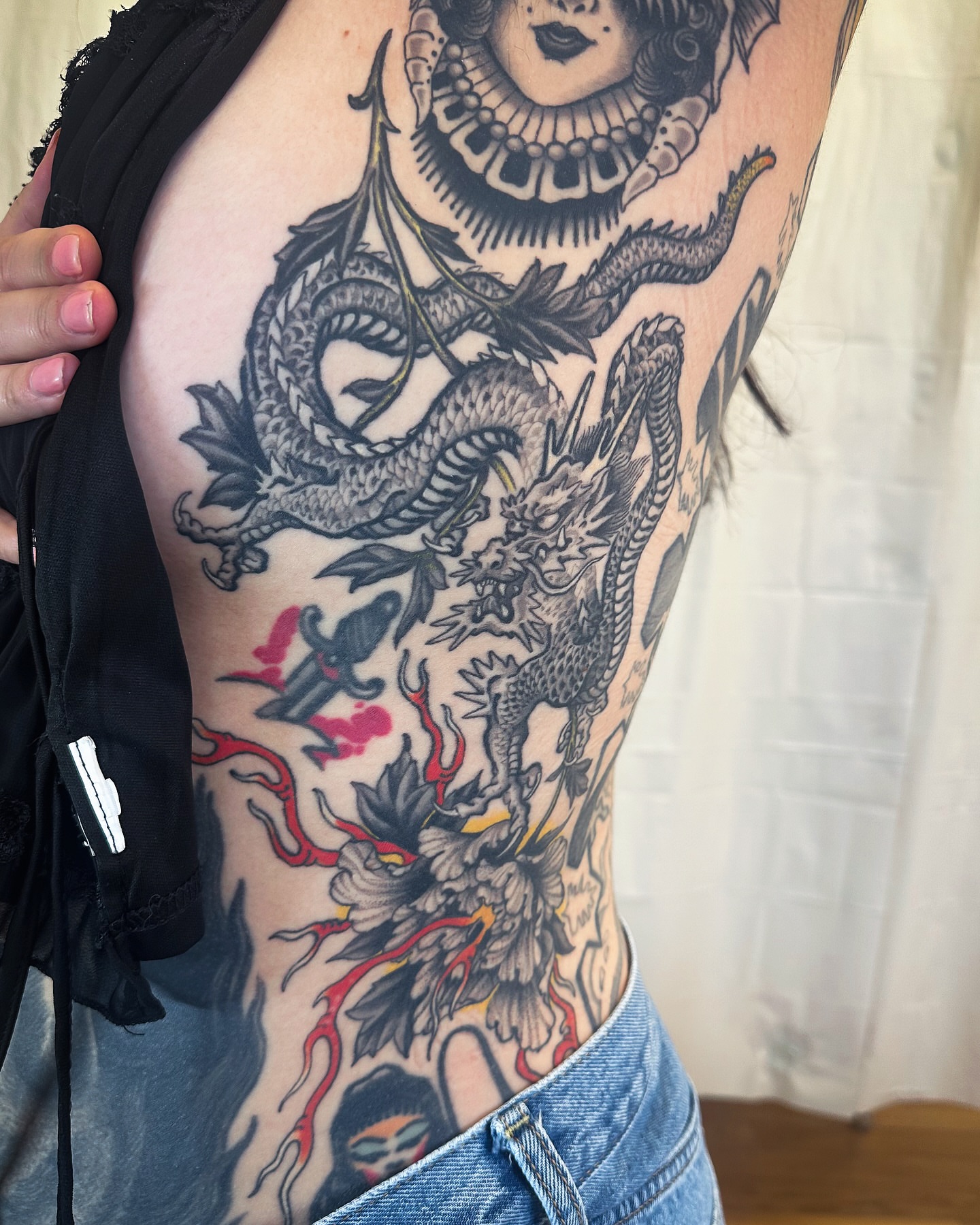 Dragon and woman American traditional tattoo on the ribs by Colin Kenji Baker, San Jose, California