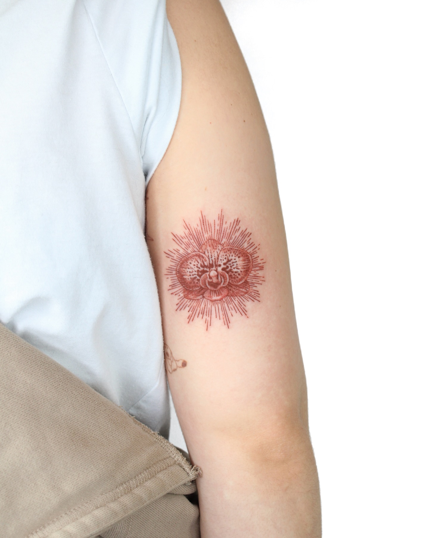 Sunburst dotwork tattoo on the forearm by Tatmostat