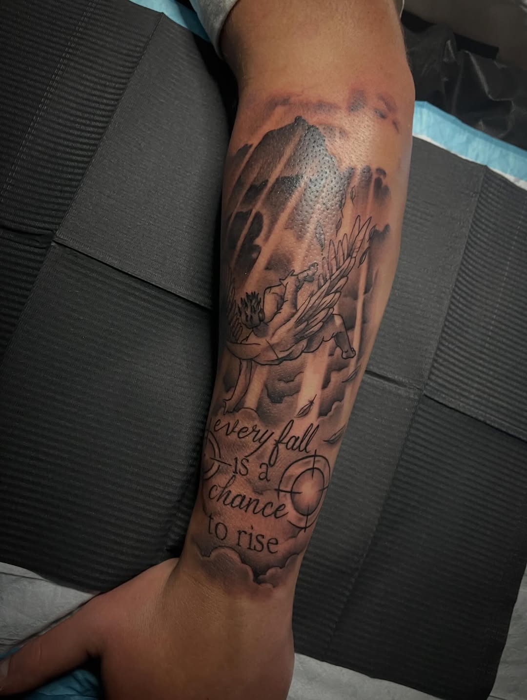 Angel and quote realism tattoo on the forearm by Chris Torres