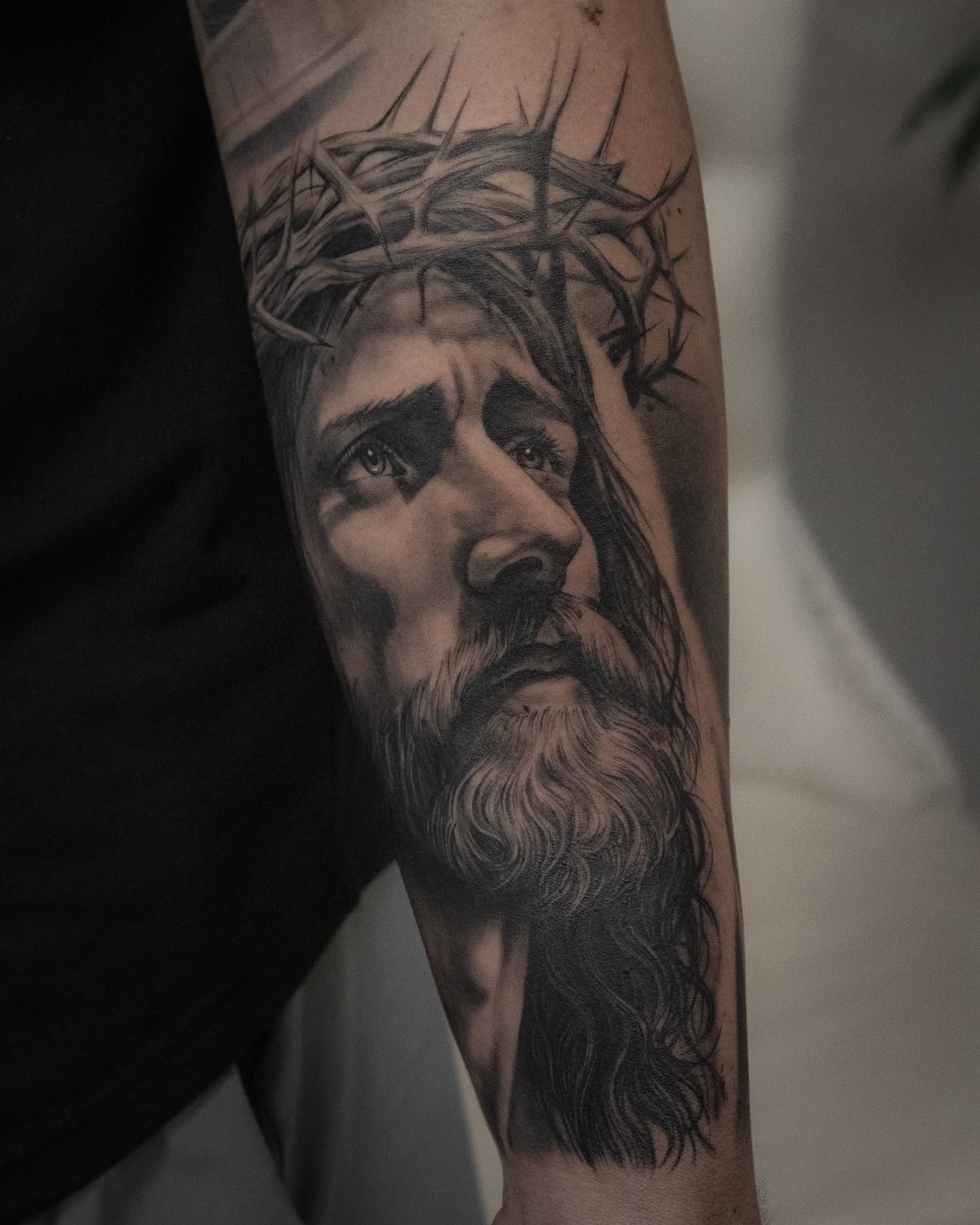 Jesus Christ realism tattoo on the forearm by Erik Bonilla